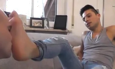 Young alpha feet licking
