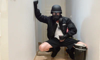 Gas masked guy cums on his rubber boots